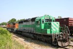 FURX 3008 & BNSF 4897 sit in a siding as a CSX train rolls by